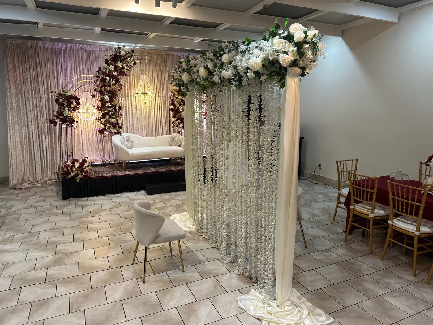 Stage dressed in blush and burgundy